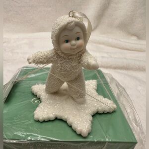 New in box Department 56 Snowbabies snowbaby on a snowflake ornament.